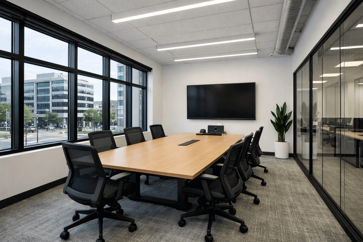 Commercial meeting room with secure glass window protection.
