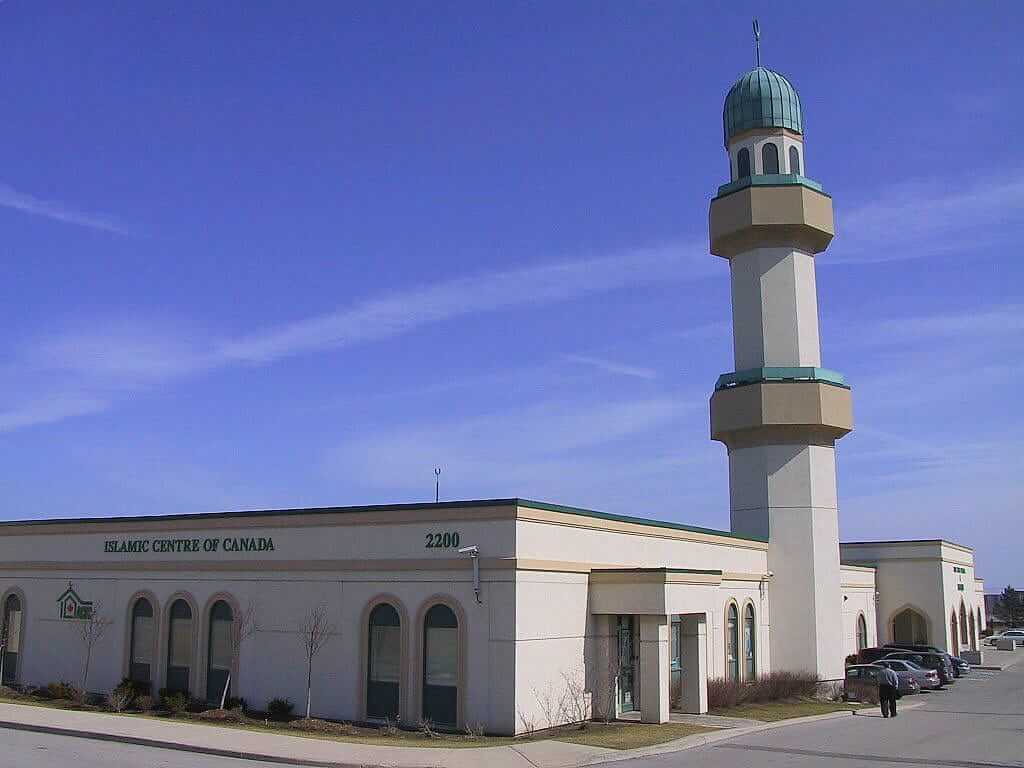 Mosque exterior with minaret and front entry